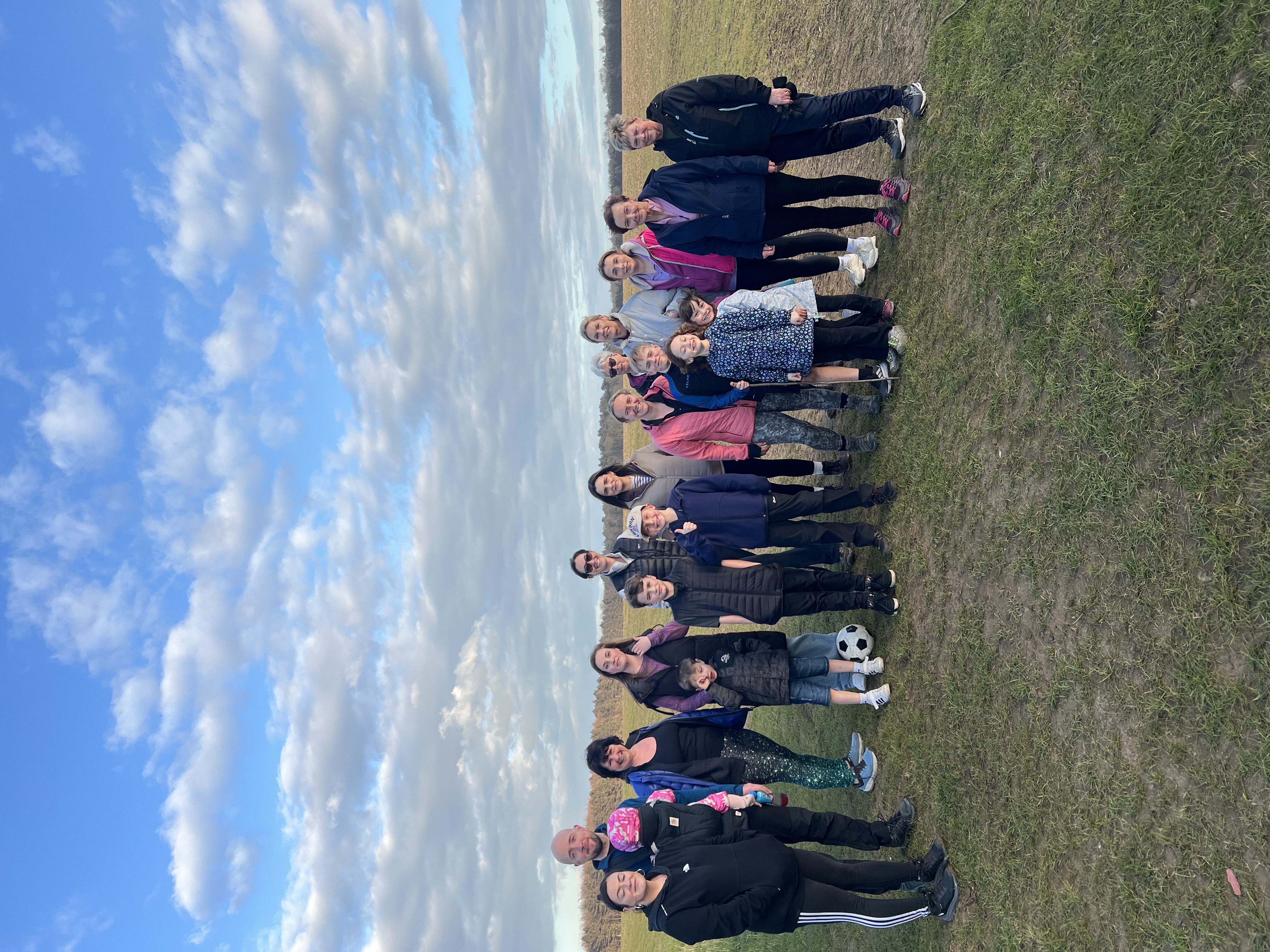 Large client group walk in a field
