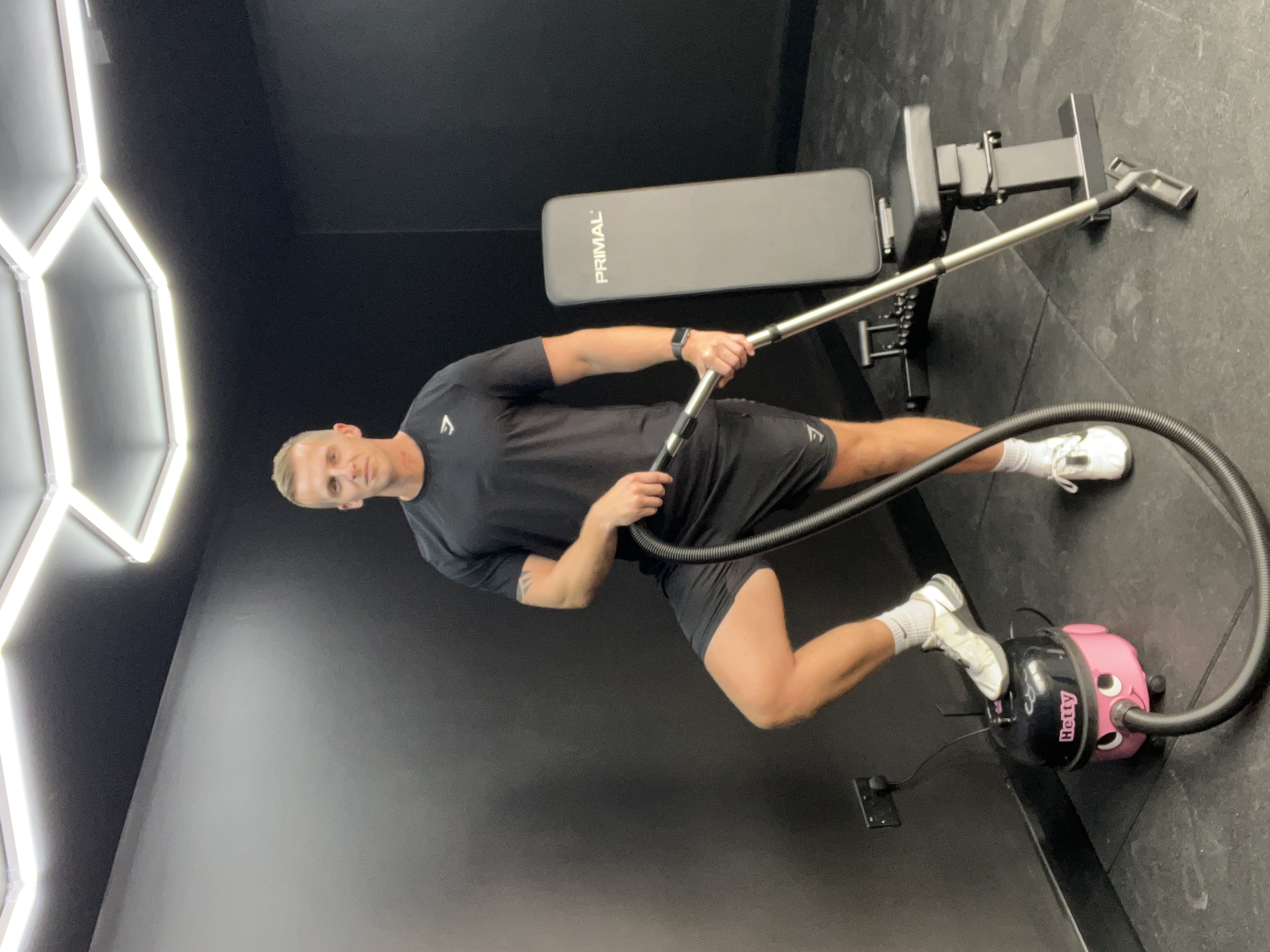 Sam with Hetty hoover in home gym