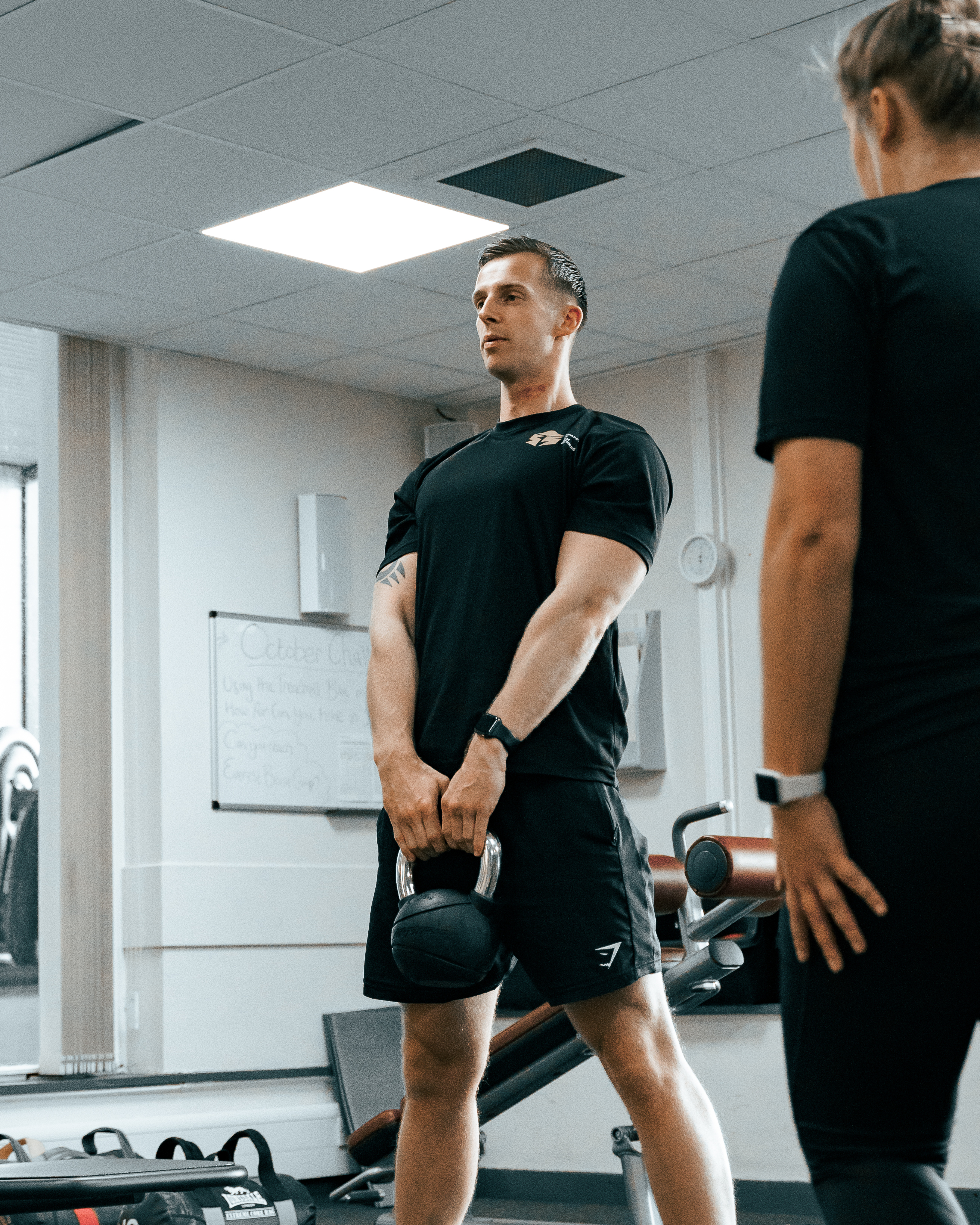 Sam coaching a client — Shaped by Sam Fitness