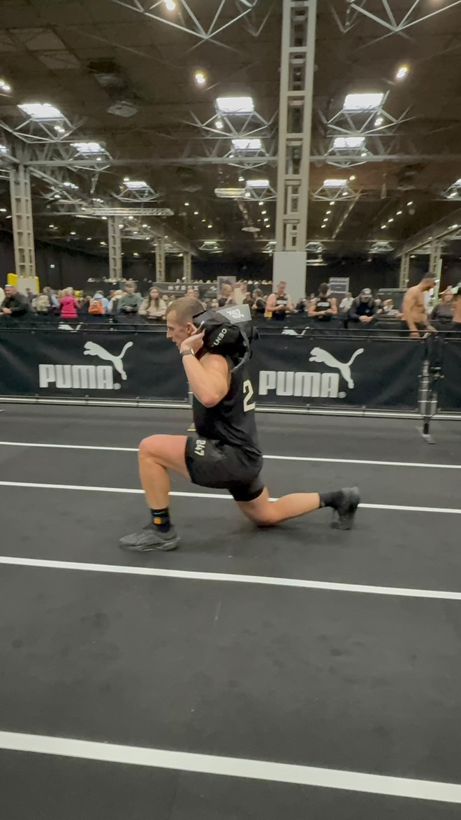 Sam completing sandbag lunges at Hyrox