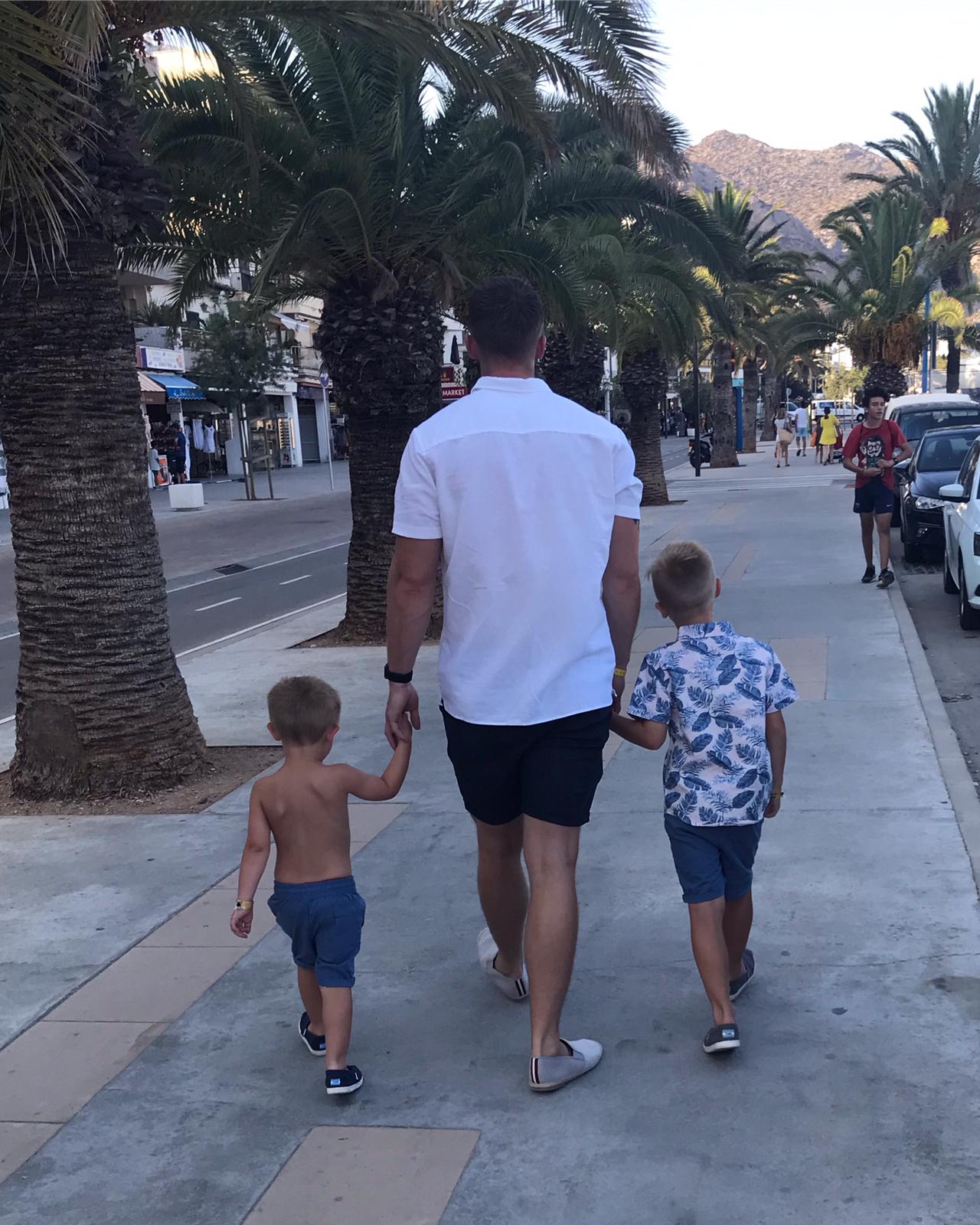 Sam walking with boys in Majorca